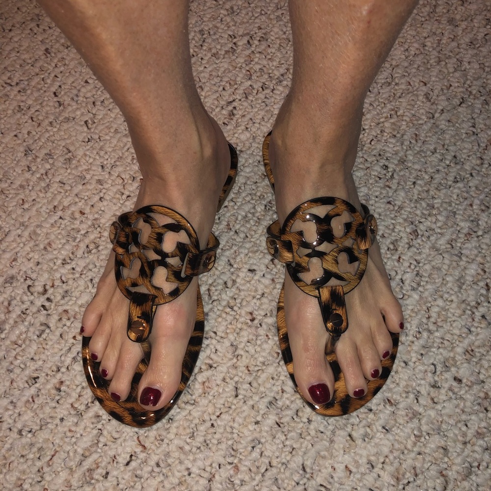 Tory Burch Leopard patent leather flip flops.